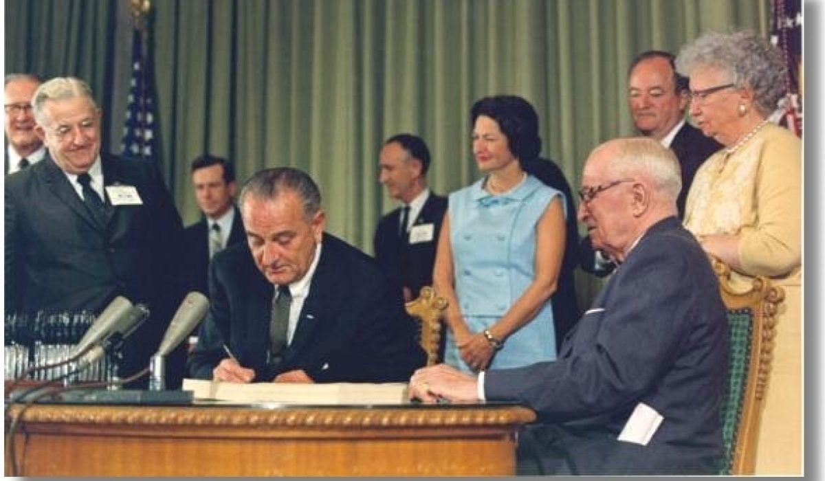 President Johnson signing Medicare into law